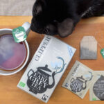 Bertie (the cat) reviews Clipper Earl Grey tea and packaging.