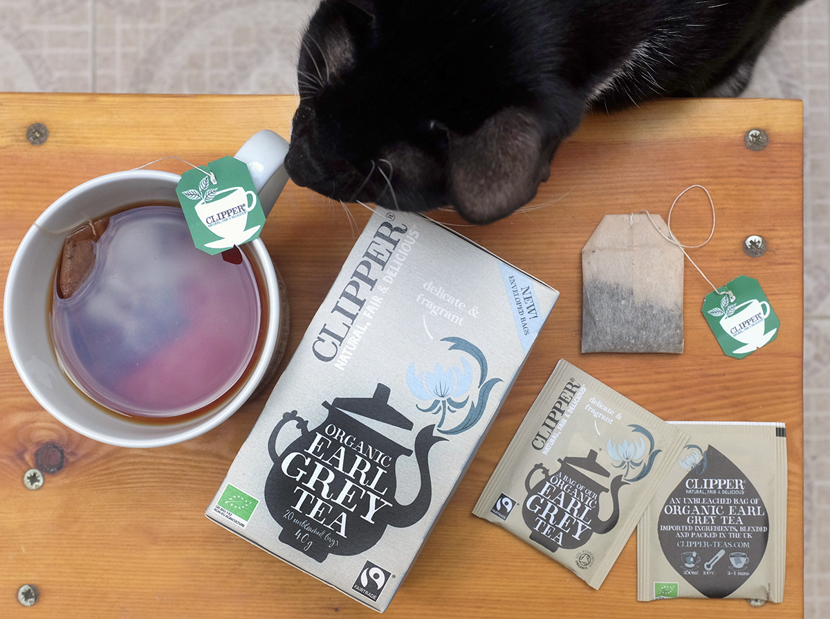 Bertie (the cat) reviews Clipper Earl Grey tea and packaging.